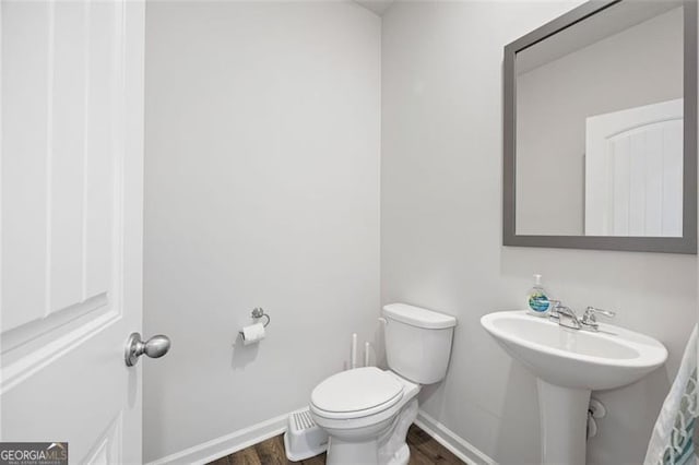 312 Deer Run Dr, Dallas, GA 30132 - bathroom with wood finished floors, toilet, and baseboards