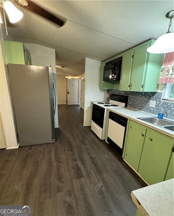 133 Angeline Cir, Eatonton, GA 31024 - kitchen with white appliances, green cabinets, dark wood-style floors, a sink, and light countertops
