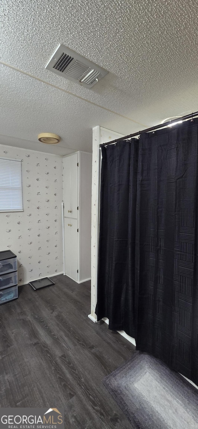 133 Angeline Cir, Eatonton, GA 31024 - empty room with dark wood finished floors and a textured ceiling