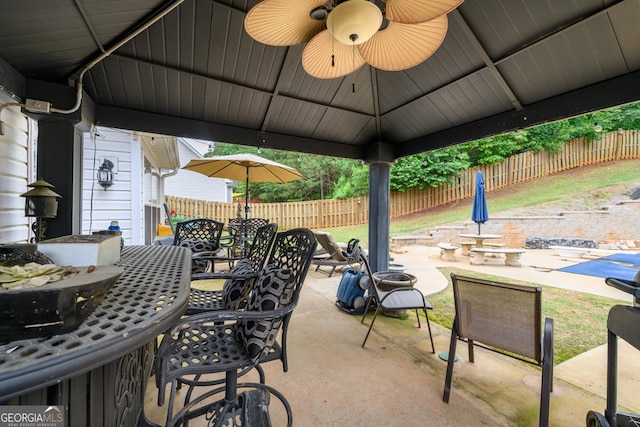 7282 Litany Ct, Flowery Branch, GA 30542 - view of patio / terrace with outdoor dining space and a ceiling fan