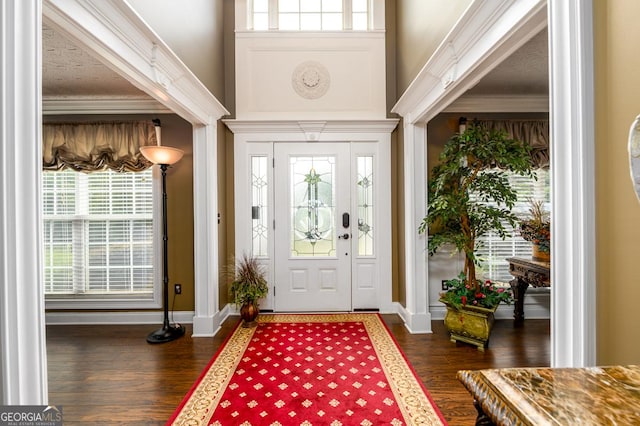 7282 Litany Ct, Flowery Branch, GA 30542 - foyer with crown molding, dark wood finished floors, and a towering ceiling
