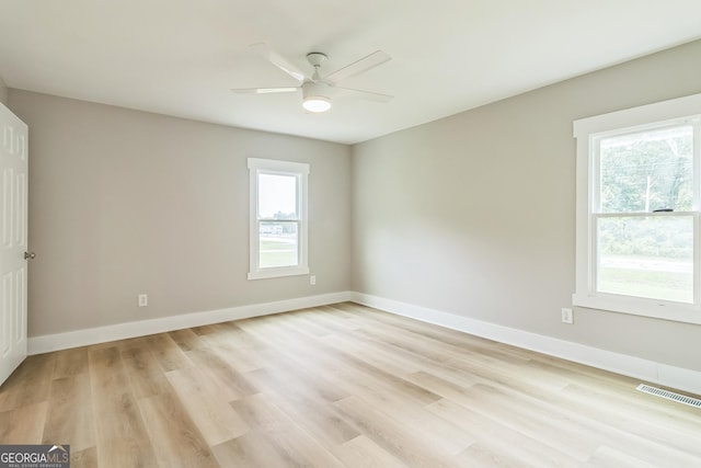 262 Gray Hwy, Gordon, GA 31031 - empty room with light wood-style flooring, a ceiling fan, and baseboards