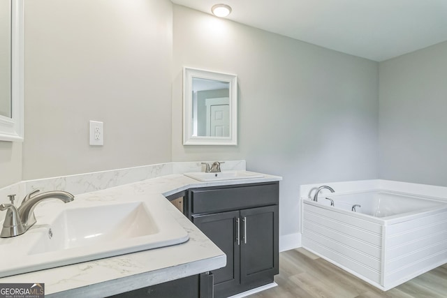 262 Gray Hwy, Gordon, GA 31031 - bathroom featuring double vanity, wood finished floors, and a bath