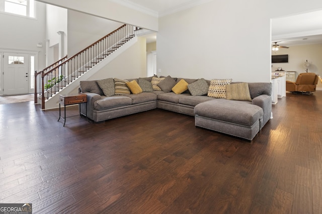 152 Jackson Dr, Forsyth, GA 31029 - living area with stairs, dark wood-type flooring, a ceiling fan, and ornamental molding