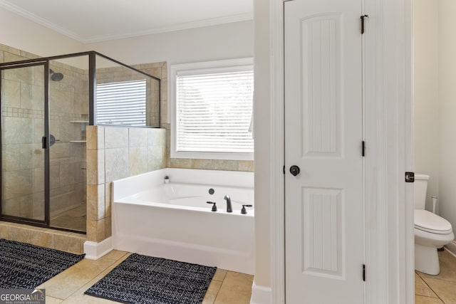 152 Jackson Dr, Forsyth, GA 31029 - full bath featuring a bath, a stall shower, tile patterned flooring, toilet, and crown molding