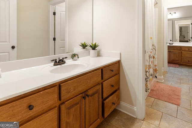 152 Jackson Dr, Forsyth, GA 31029 - bathroom with vanity, baseboards, and a shower with curtain