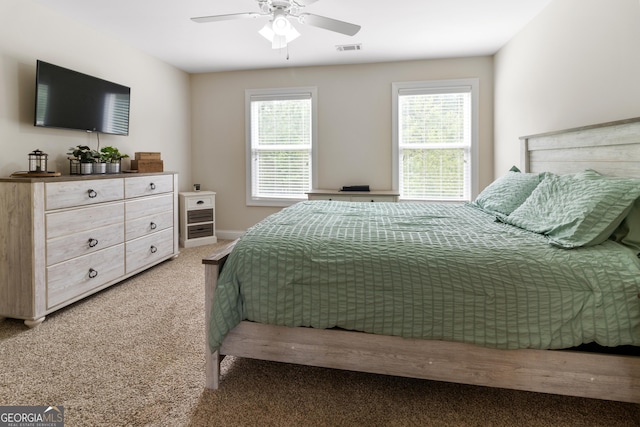 152 Jackson Dr, Forsyth, GA 31029 - carpeted bedroom with a ceiling fan and baseboards