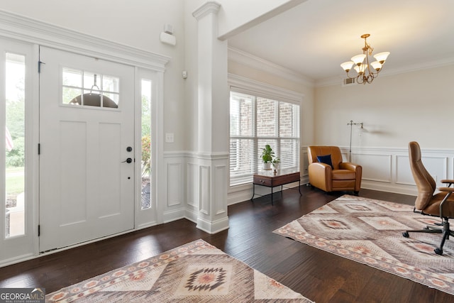 152 Jackson Dr, Forsyth, GA 31029 - entrance foyer featuring wood-type flooring, a chandelier, a decorative wall, a wainscoted wall, and ornamental molding