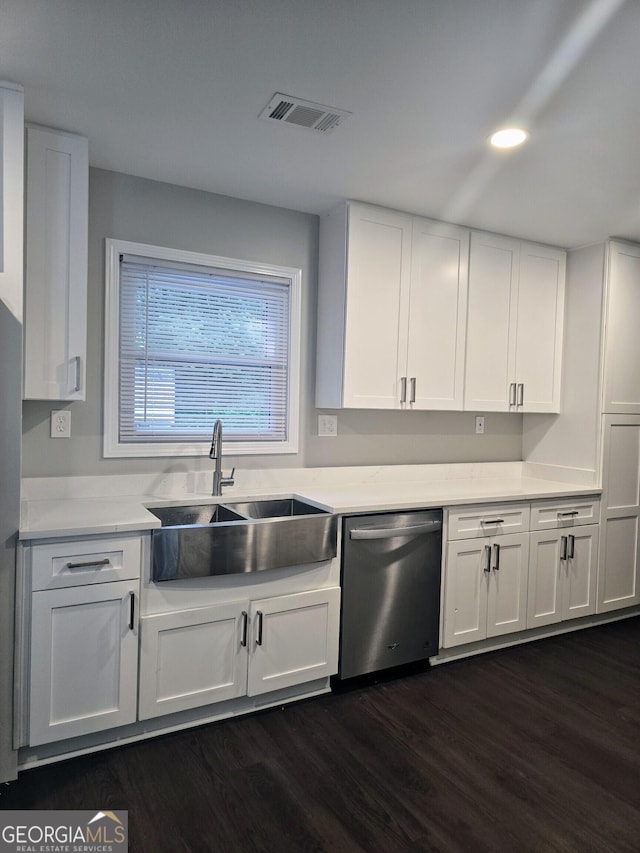5425 Herndon Blvd, Morrow, GA 30260 - kitchen featuring stainless steel dishwasher, a sink, white cabinetry, dark wood finished floors, and light countertops