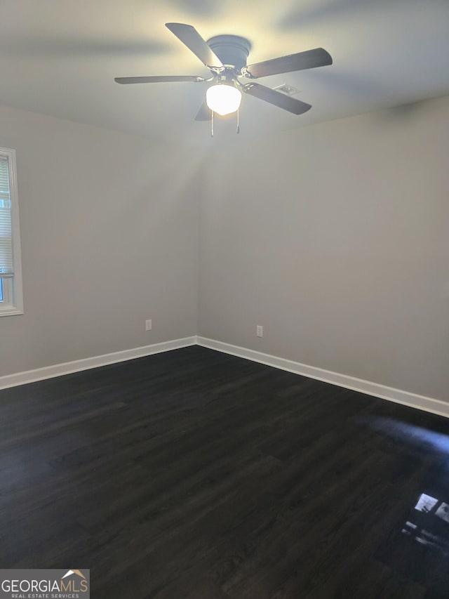 5425 Herndon Blvd, Morrow, GA 30260 - spare room with dark wood-style floors, baseboards, and a ceiling fan