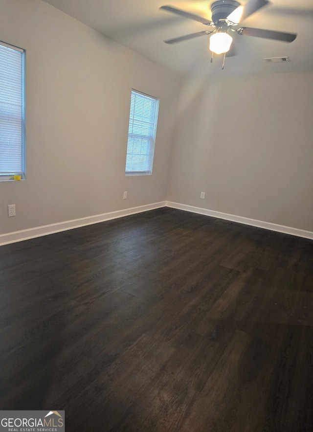 5425 Herndon Blvd, Morrow, GA 30260 - empty room featuring dark wood-style flooring, a ceiling fan, and baseboards