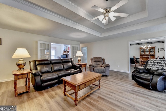 3265 Bold Springs Rd, Dacula, GA 30019 - living room with a raised ceiling, light wood-style floors, baseboards, and ornamental molding