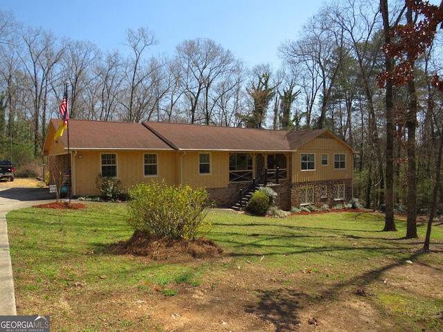 141 Cherokee Cir, Cedartown, GA 30125 - view of front of house featuring a front yard, covered porch, and stairway