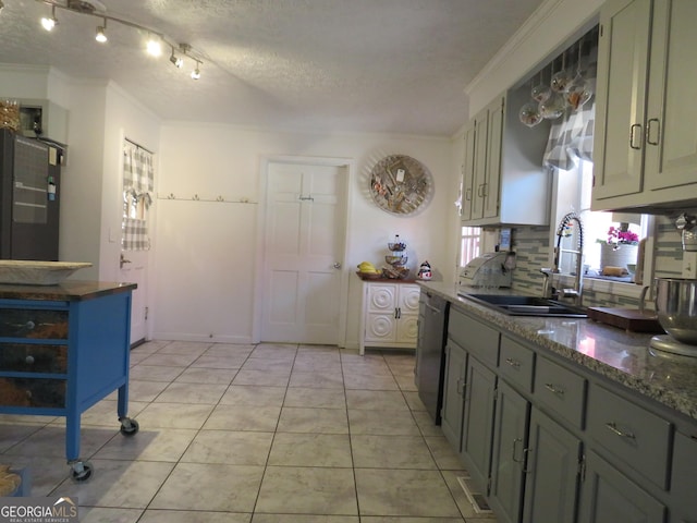 141 Cherokee Cir, Cedartown, GA 30125 - kitchen with a sink, dishwashing machine, ornamental molding, backsplash, and light tile patterned floors