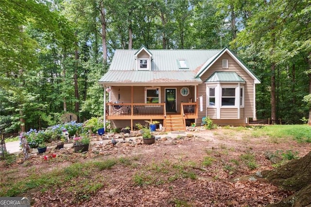 141 Mills Creek Path, Hiram, GA 30141 - view of front of home featuring a porch, a metal roof, and view of wooded area