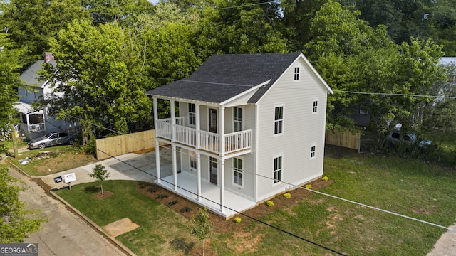 621 Arthur St, Lagrange, GA 30241 - back of house with a shingled roof, a patio area, and a balcony