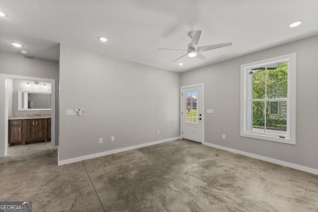 621 Arthur St, Lagrange, GA 30241 - empty room with finished concrete flooring, healthy amount of natural light, ceiling fan, baseboards, and recessed lighting