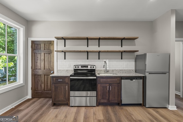 621 Arthur St, Lagrange, GA 30241 - kitchen featuring stainless steel appliances, open shelves, a sink, and dark brown cabinetry
