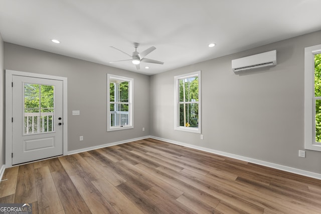 621 Arthur St, Lagrange, GA 30241 - empty room featuring a wall mounted air conditioner, wood finished floors, ceiling fan, baseboards, and recessed lighting