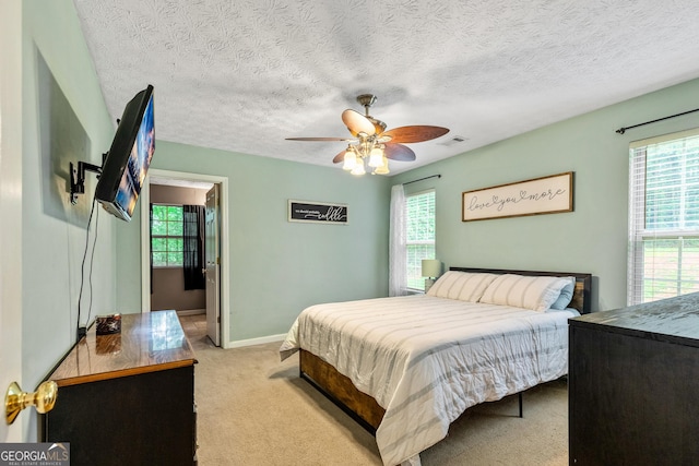 460 Old Tree Dr, Jackson, GA 30233 - bedroom with multiple windows, light carpet, a textured ceiling, and baseboards