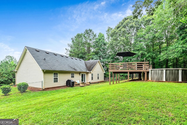 460 Old Tree Dr, Jackson, GA 30233 - back of property with roof with shingles and a deck