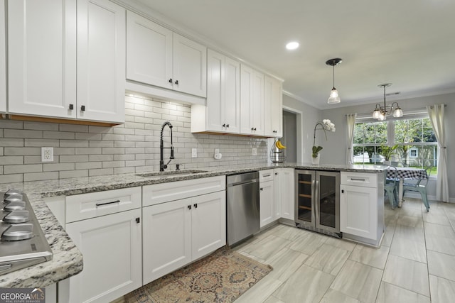 510 Braves Field Dr, Guyton, GA 31312 - kitchen featuring wine cooler, a sink, appliances with stainless steel finishes, ornamental molding, and white cabinets