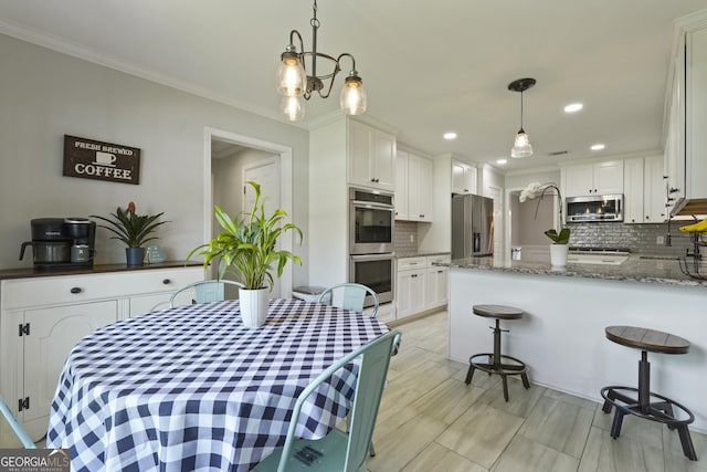 510 Braves Field Dr, Guyton, GA 31312 - dining room with crown molding and recessed lighting