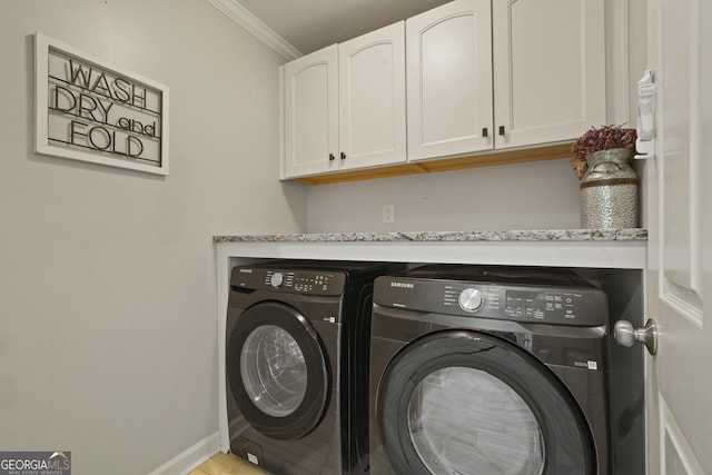 510 Braves Field Dr, Guyton, GA 31312 - laundry area with cabinet space, washer and dryer, ornamental molding, and baseboards