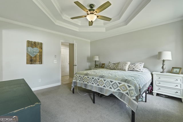 510 Braves Field Dr, Guyton, GA 31312 - carpeted bedroom with a tray ceiling, crown molding, baseboards, and ceiling fan