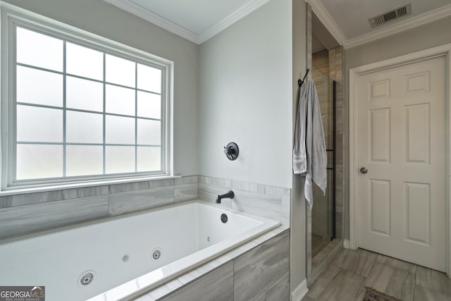 510 Braves Field Dr, Guyton, GA 31312 - full bathroom with a stall shower, a tub with jets, plenty of natural light, and ornamental molding