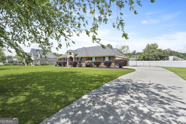 510 Braves Field Dr, Guyton, GA 31312 - single story home with concrete driveway, a garage, and brick siding