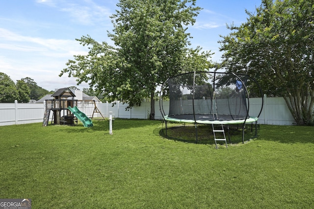 510 Braves Field Dr, Guyton, GA 31312 - view of yard with a trampoline and a playground