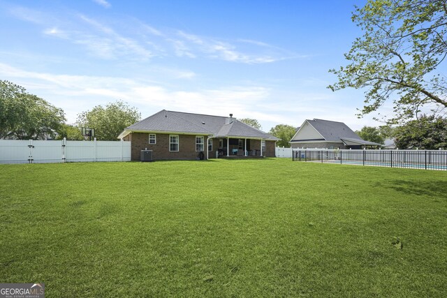 510 Braves Field Dr, Guyton, GA 31312 - rear view of house with central air condition unit and brick siding