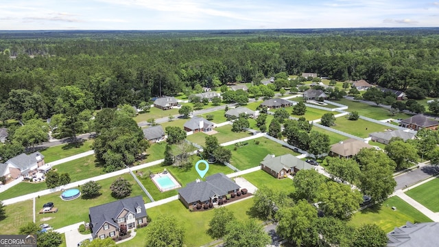 510 Braves Field Dr, Guyton, GA 31312 - aerial perspective of suburban area featuring a heavily wooded area