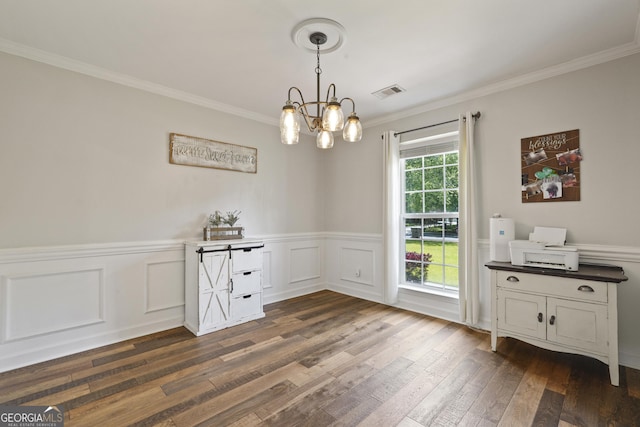 510 Braves Field Dr, Guyton, GA 31312 - unfurnished dining area featuring dark wood-style floors, crown molding, a wainscoted wall, a chandelier, and a decorative wall