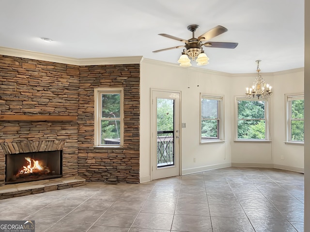 232 Darwish Dr, Mcdonough, GA 30252 - unfurnished living room with a ceiling fan, a stone fireplace, a chandelier, ornamental molding, and tile patterned flooring