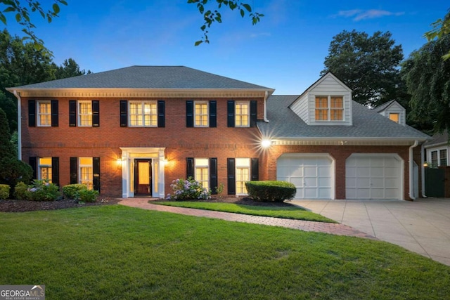 2903 Ashebrooke Dr NE, Marietta, GA 30068 - colonial inspired home featuring driveway, an attached garage, a front lawn, brick siding, and roof with shingles