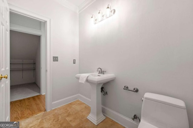 2903 Ashebrooke Dr NE, Marietta, GA 30068 - half bathroom with toilet, ornamental molding, and baseboards