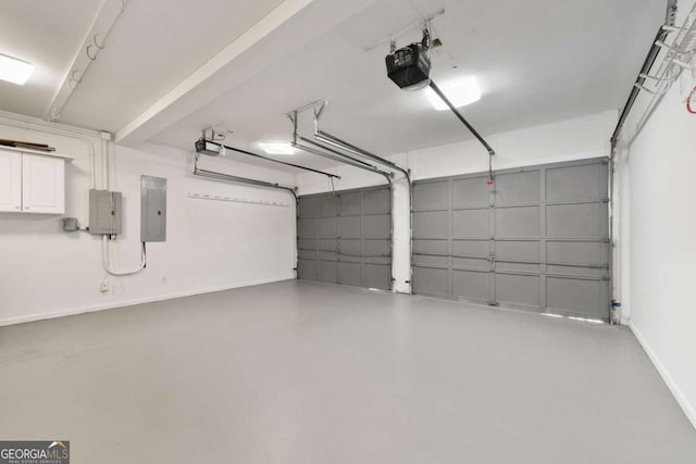 2903 Ashebrooke Dr NE, Marietta, GA 30068 - garage with electric panel, a garage door opener, and baseboards