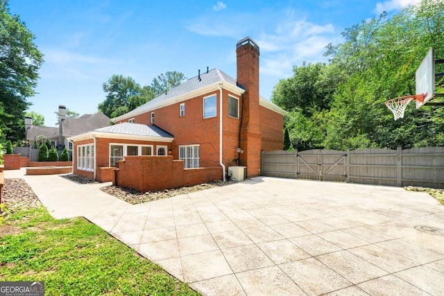 2903 Ashebrooke Dr NE, Marietta, GA 30068 - rear view of property with a chimney, brick siding, and a gate