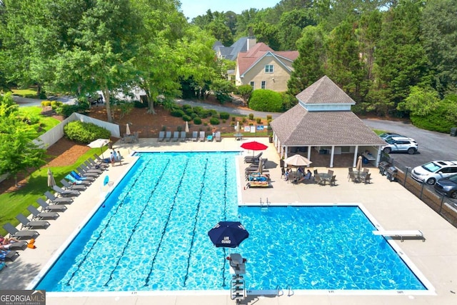 2903 Ashebrooke Dr NE, Marietta, GA 30068 - community pool with a patio, a diving board, and an outbuilding