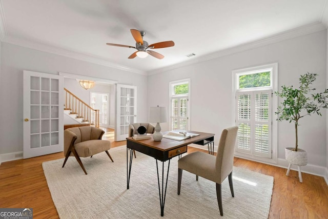 2903 Ashebrooke Dr NE, Marietta, GA 30068 - dining space with french doors, light wood-style floors, baseboards, ornamental molding, and a ceiling fan