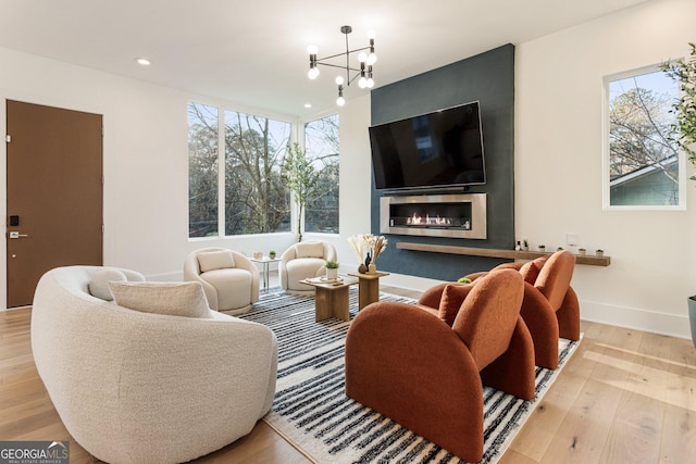 1045 Shepherds Ln NE, Atlanta, GA 30324 - living area with healthy amount of natural light, a chandelier, wood finished floors, and recessed lighting