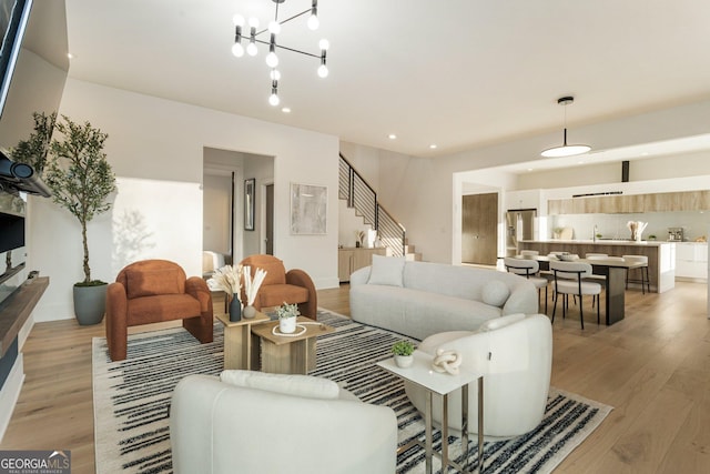 1045 Shepherds Ln NE, Atlanta, GA 30324 - living room featuring light wood finished floors, stairway, and recessed lighting