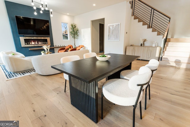 1045 Shepherds Ln NE, Atlanta, GA 30324 - dining space with wood finished floors, stairs, a fireplace, recessed lighting, and radiator heating unit