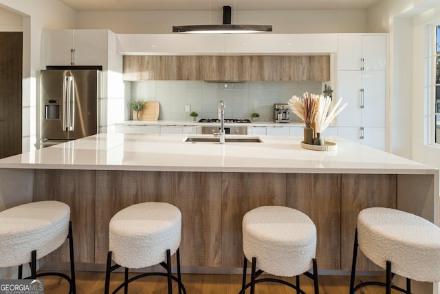 1045 Shepherds Ln NE, Atlanta, GA 30324 - kitchen with stainless steel refrigerator with ice dispenser, decorative backsplash, modern cabinets, and light countertops