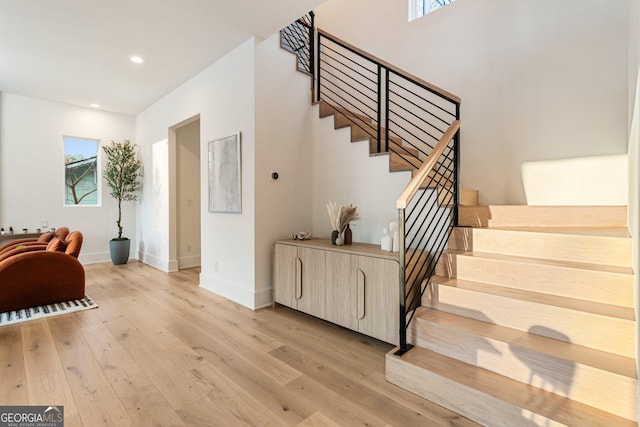 1045 Shepherds Ln NE, Atlanta, GA 30324 - stairs with wood finished floors and recessed lighting
