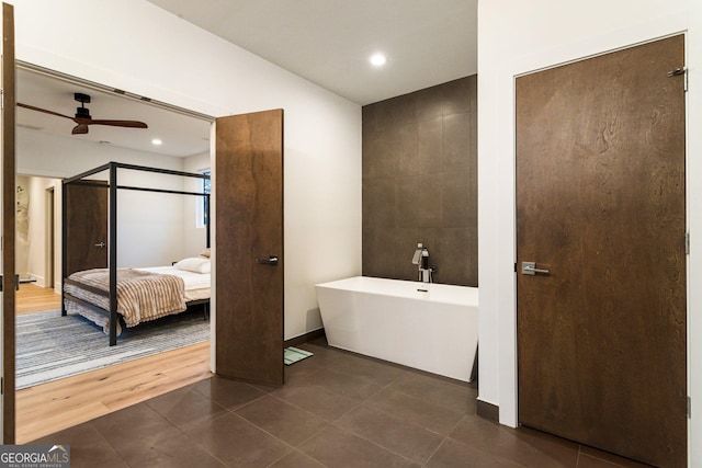 1045 Shepherds Ln NE, Atlanta, GA 30324 - ensuite bathroom featuring a ceiling fan, a freestanding bath, tile patterned floors, and recessed lighting