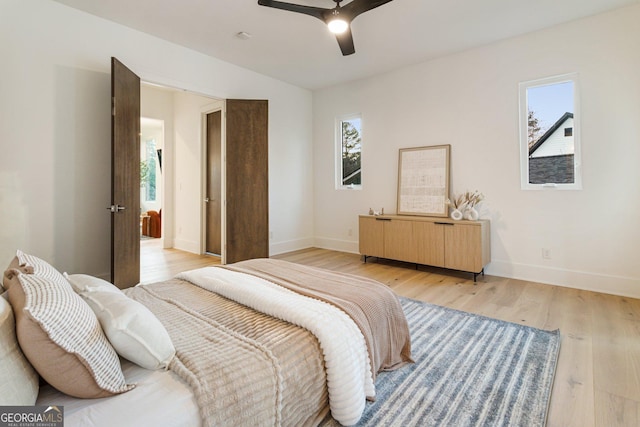 1045 Shepherds Ln NE, Atlanta, GA 30324 - bedroom with multiple windows, light wood-style floors, and ceiling fan