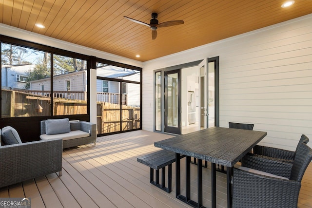 1045 Shepherds Ln NE, Atlanta, GA 30324 - sunroom featuring ceiling fan and outdoor dining space